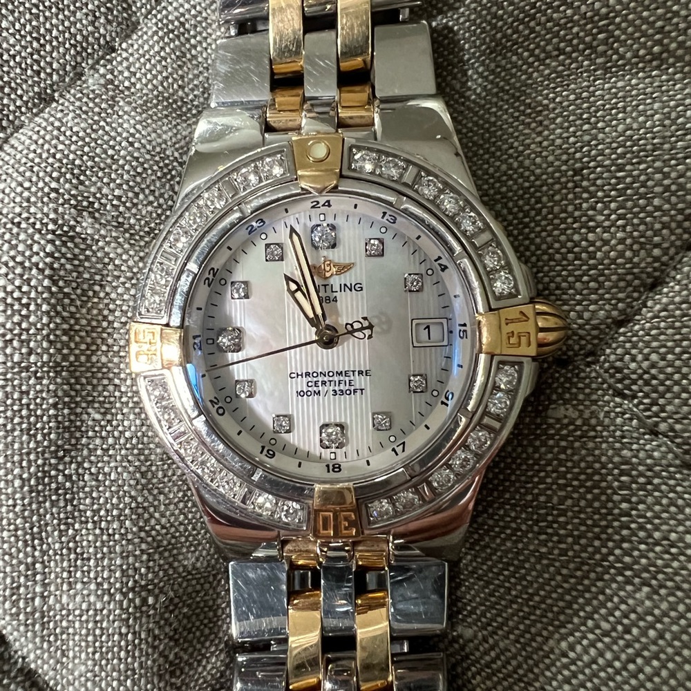 Breitling women’s Starliner Steel Yellow Gold Diamond Mother of Pearl Watch